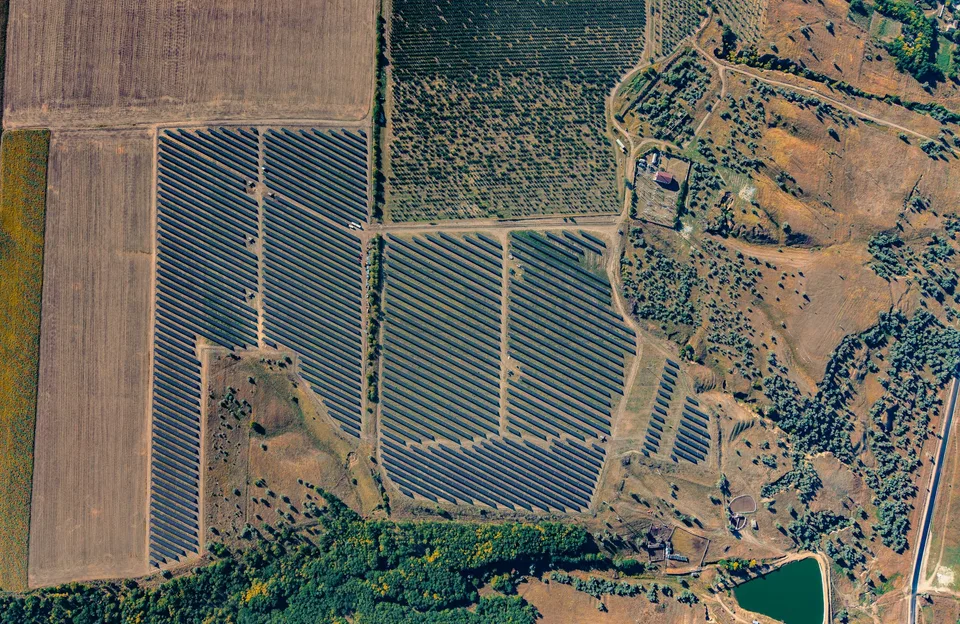 Aerial view of a ground-mounted solar farm, illustrating renewable energy infrastructure