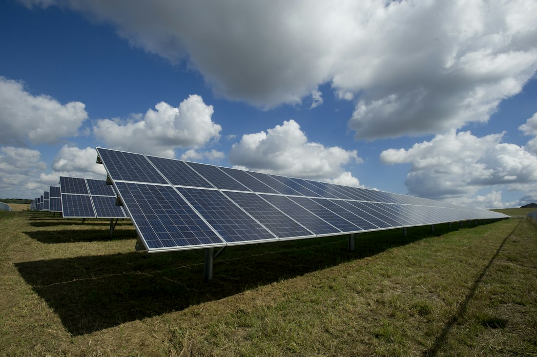 Rows of photovoltaic panels at a solar energy installation